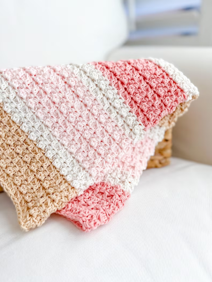 crocheted pastel blanket