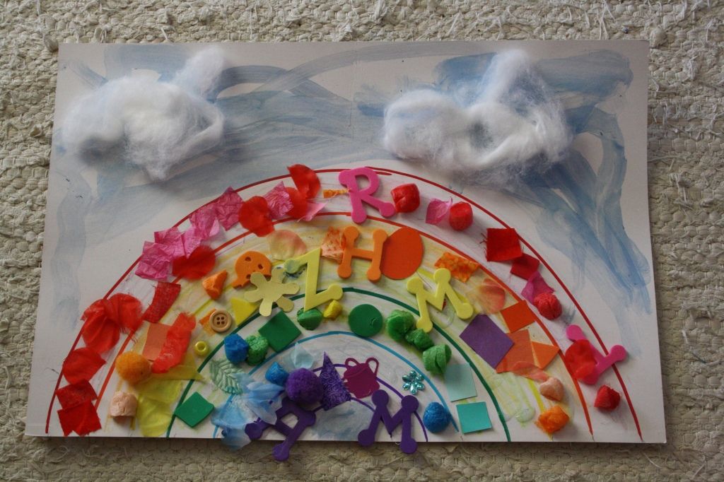 rainbow collage art with buttons and letters